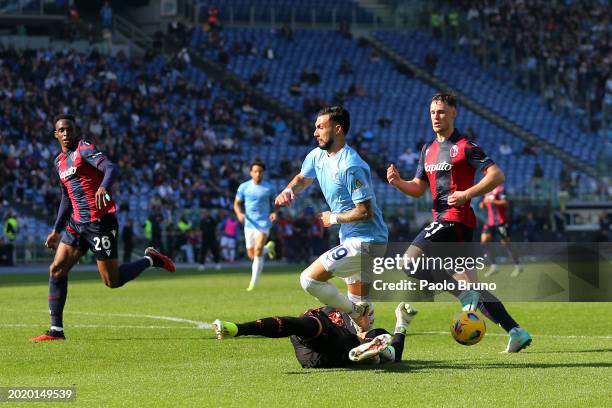 Lukasz Skorupski of Bologna FC battles for possession with Valentin Castellanos of SS Lazio during the Serie A TIM match between SS Lazio and Bologna...