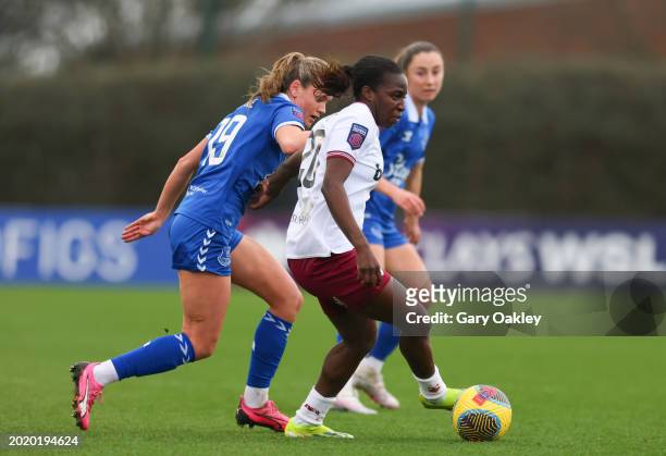 Viviane Asseyi of West Ham United holds off Heather Payne of Everton during the Barclays Women's Super League match between Everton FC and West Ham...