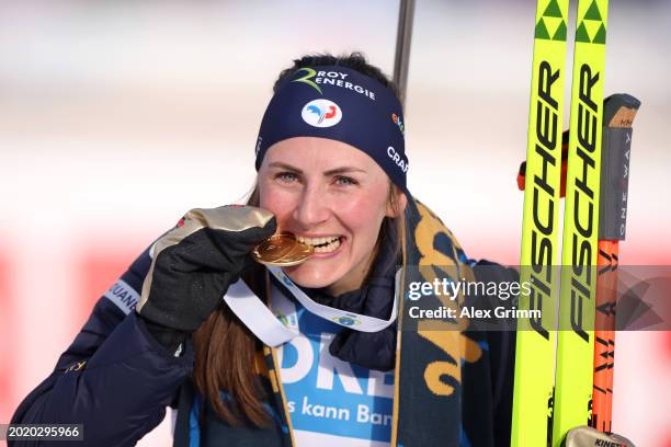 Gold medallist Justine Braisaz-Bouchet of France poses for a photo after the Women's 12.5KM Mass Start at the IBU World Championships Biathlon Nove...