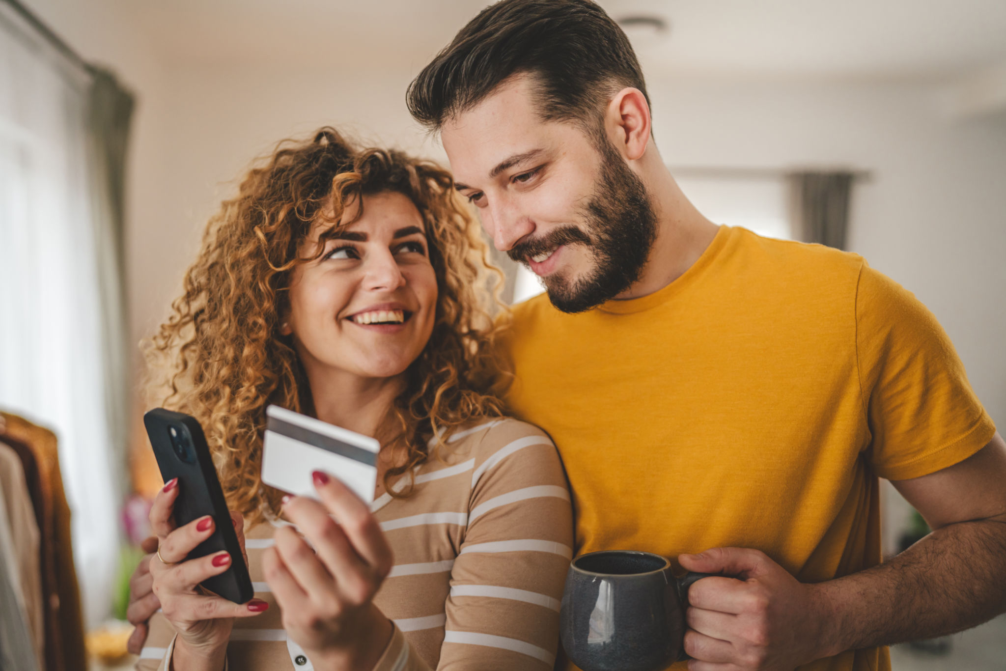 adult happy couple man and woman shopping online hold credit card adult happy couple man and woman shopping online hold credit card