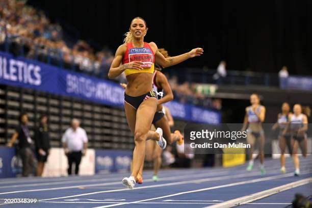 Gold medalist, Laviai Nielsen of Great Britain, crosses the line in the Women's 400m Final during day two of the 2024 Microplus UK Athletics Indoor...