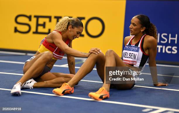 Gold medalist, Laviai Nielsen Silver medalist, Lina Nielsen of Great Britain , interact following the Women's 400m Final during day two of the 2024...