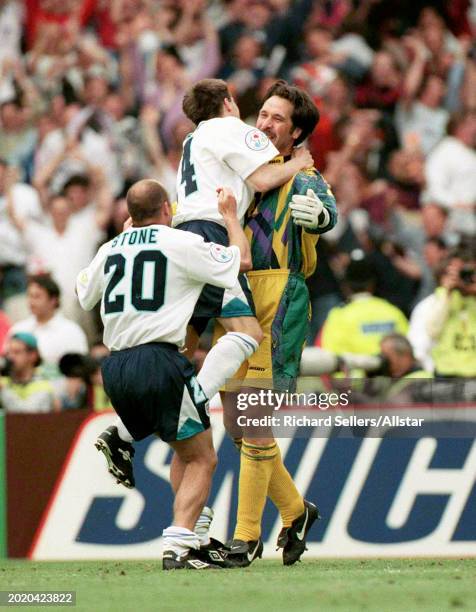 June 22: David Seaman of England after saving the penalty which put England through to the Semi Final celebrates with Steve Stone and Nick Barmby of...