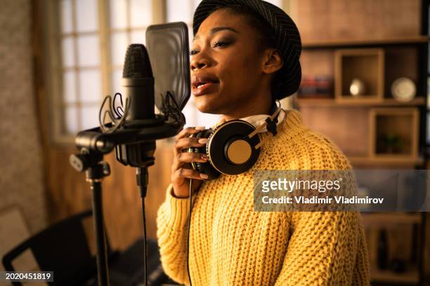 close up of a professional singer and microphone - pork pie stock pictures, royalty-free photos & images