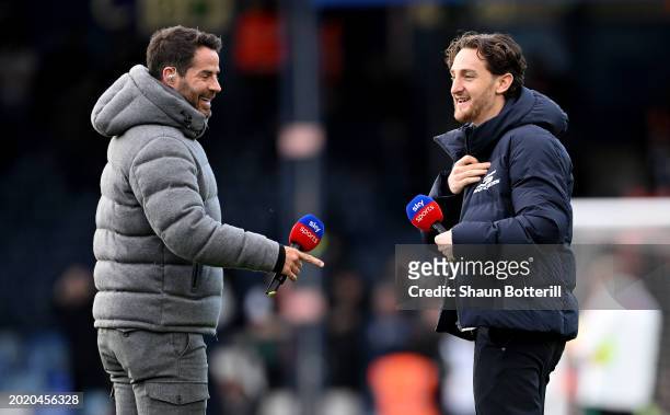Jamie Redknapp, Sky Sports pundit interacts with Tom Lockyer of Luton Town prior to the Premier League match between Luton Town and Manchester United...