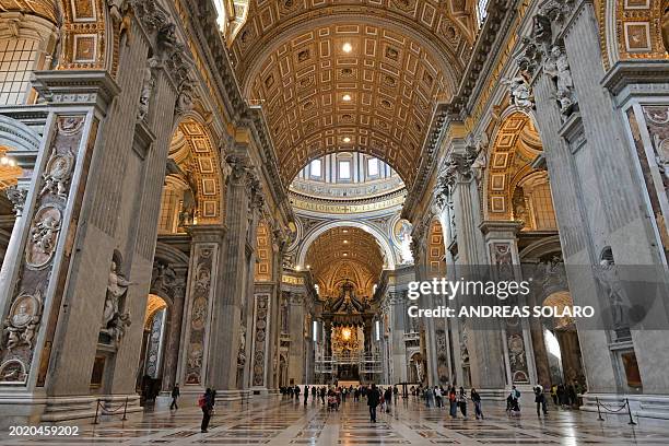 Scaffolding is mounted around the baldachin of St. Peter's basilica to start its restoration on February 21, 2024 in the Vatican. The large Baroque...