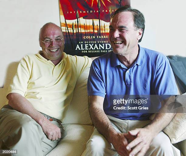 Intermedia CEO Moritz Borman and director Oliver Stone pose for a portrait at the Inermedia and Summit Sales offices during 56th International Cannes...