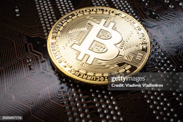 bitcoin - globally traded financial asset - printed circuit b stock pictures, royalty-free photos & images