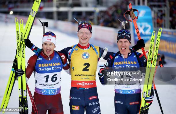 Andrejs Rastorgujevs of Latvia, Johannes Thingnes Boe of Norway and Quentin Fillon Maillet of France pose for a photo after competing in Men's 15KM...