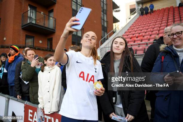 Molly Bartrip of Tottenham Hotspur poses for a photograph with fans, as she take a selfie on a mobile phone, after the Barclays Women's Super League...