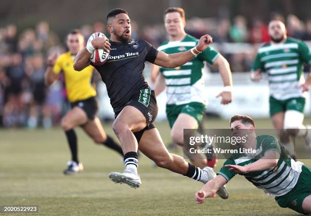 Phil Cokanasiga of Leicester Tigers evades a tackle by Dan Lancaster of of Ealing Trailfinders to score a try during the Premiership Rugby Cup match...