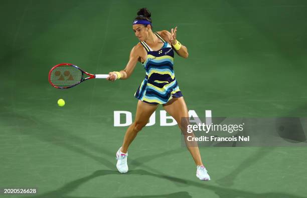Caroline Garcia of France plays a shot against Ashlyn Krueger of USA during the Dubai Duty Free Tennis Championships, part of the Hologic WTA Tour at...