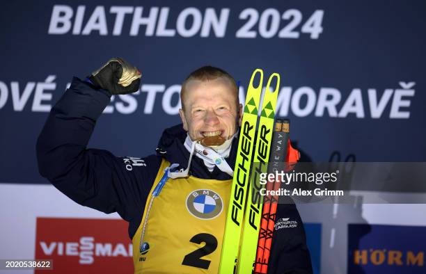 Johannes Thingnes Boe of Norway celebrates on the podium after finishing in First Place after competing in Men's 15KM Mass Start at the IBU World...