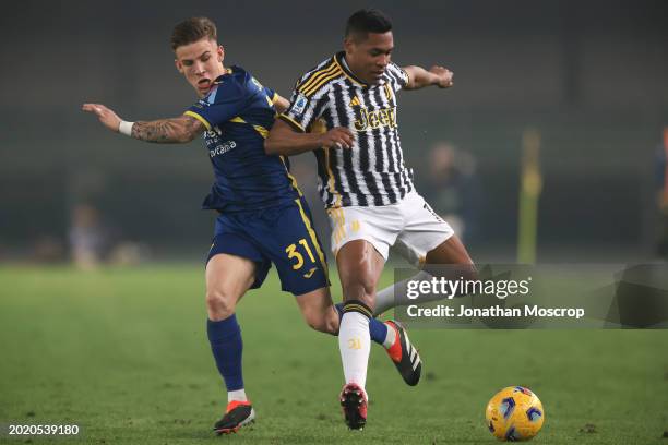 Tomas Suslov of Hellas Verona tussles with Alex Sandro of Juventus during the Serie A TIM match between Hellas Verona FC and Juventus - Serie A TIM...