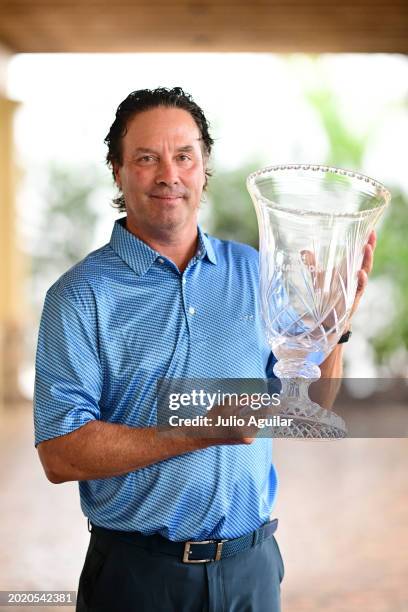 Stephen Ames of Canada poses with the trophy after winning the Chubb Classic at Tiburon Golf Club on February 18, 2024 in Naples, Florida.