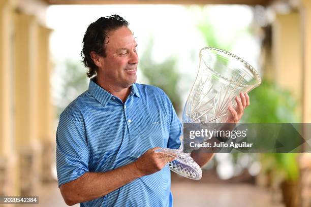 Stephen Ames of Canada poses with the trophy after winning the Chubb Classic at Tiburon Golf Club on February 18, 2024 in Naples, Florida.