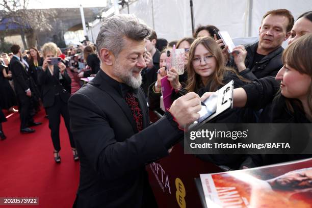 Andy Serkis signs autographs for fans as he attends the EE BAFTA Film Awards 2024 at The Royal Festival Hall on February 18, 2024 in London, England.