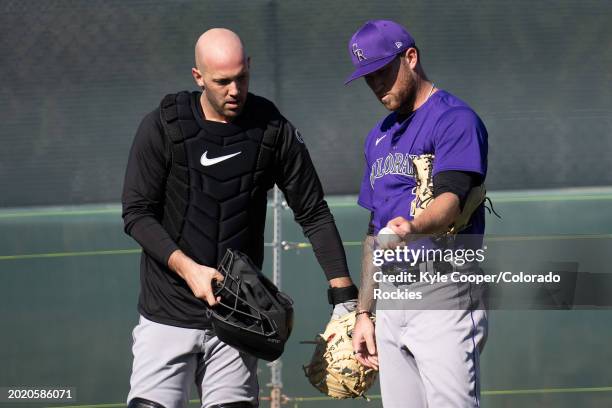 Catcher Jacob Stallings of the Colorado Rockies talks with pitcher Kyle Freeland after a bullpen session at Salt River Fields at Talking Stick on...