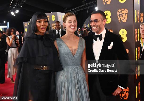 Naomi Campbell, Rosamund Pike and Mohammed Al Turki attend the 2024 EE BAFTA Film Awards at The Royal Festival Hall on February 18, 2024 in London,...