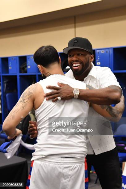 Cent hugs Anuel AA during the Ruffles NBA All-Star Celebrity Game as part of NBA All-Star Weekend on Friday, February 16, 2024 at Lucas Oil Stadium...