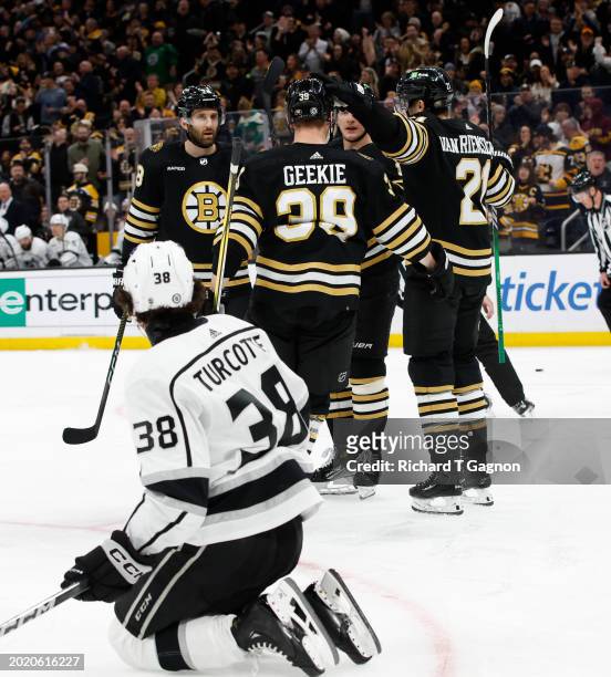 Trent Frederic of the Boston Bruins celebrates his goal against the Los Angeles Kings during the third period with teammates James van Riemsdyk,...
