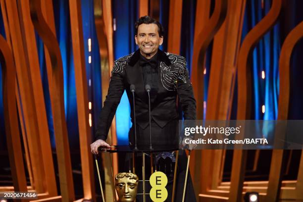 Host David Tennant on stage during the EE BAFTA Film Awards 2024 at The Royal Festival Hall on February 18, 2024 in London, England.