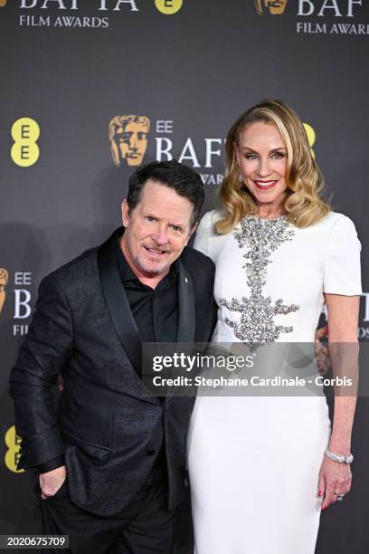 Michael J. Fox and Tracy Pollan attend the 2024 EE BAFTA Film Awards at The Royal Festival Hall on February 18, 2024 in London, England.