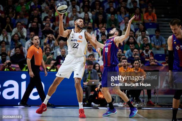 Edy Tavares of Real Madrid and Nicola Kalinic of FC Barcelona in action during the Finals of the 2024 Copa del Rey de Baloncesto match between Real...
