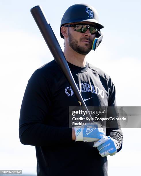 Kris Bryant of the Colorado Rockies looks on during a live batting practice at Salt River Fields at Talking Stick on February 17, 2024 in Scottsdale,...