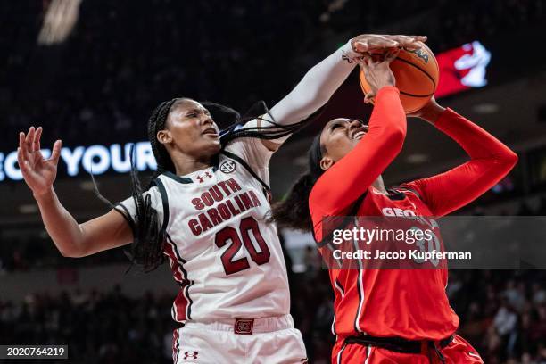 Sania Feagin of the South Carolina Gamecocks fouls Amiya Evans of the Georgia Lady Bulldogs in the second quarter during their game at Colonial Life...