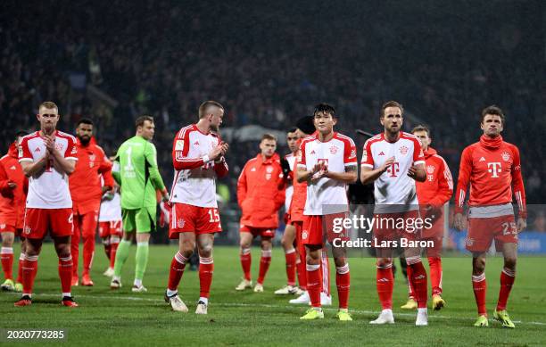 Eric Dier, Kim Min-Jae and Harry Kane of Bayern Munich applaud the fans following the Bundesliga match between VfL Bochum 1848 and FC Bayern München...