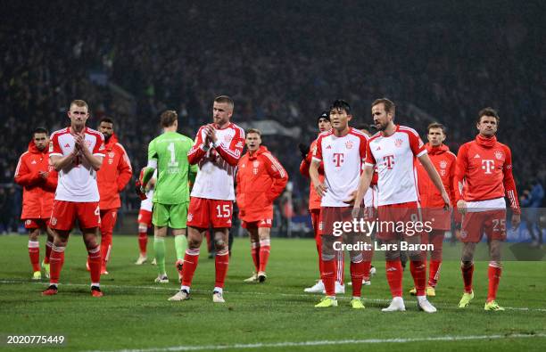 Matthijs de Ligt, Eric Dier, Kim Min-Jae and Harry Kane of Bayern Munich acknowledge the fans following the Bundesliga match between VfL Bochum 1848...