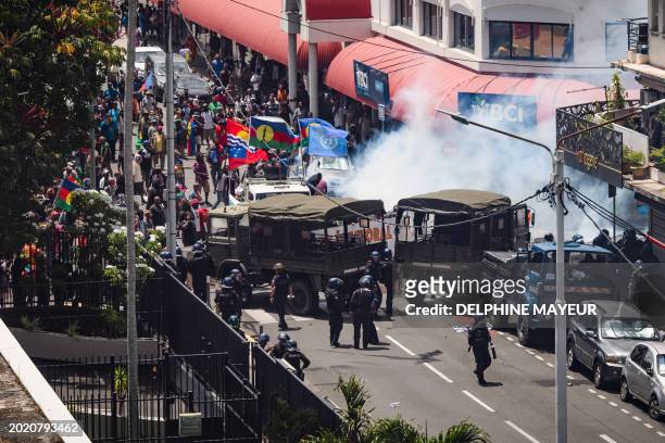Protestors clash with French gendarmes and French Republican Security Corps police officers as they fired teargas during a demonstration called by...