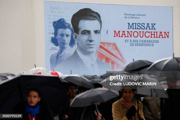 People gather to attend the state ceremony for Missak and Melinee Manouchian's induction into The Pantheon in Paris on February 21, 2024. The remains...