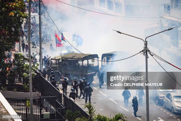 Protestors clash with French gendarmes and French Republican Security Corps police officers as they fired teargas during a demonstration called by...