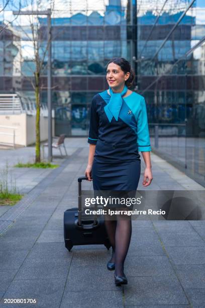 flight attendant on the way to the airport - air stewardess stock pictures, royalty-free photos & images