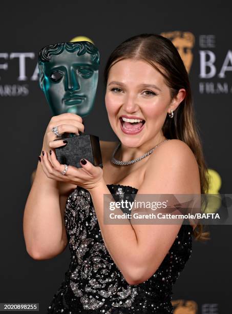 Mia Mckenna-Bruce poses with the EE Rising Star Award in the Winners Room during the EE BAFTA Film Awards 2024 at The Royal Festival Hall on February...