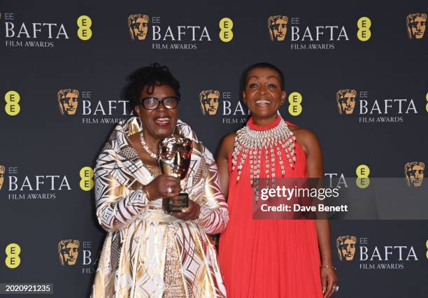 June Givanni and Adjoa Andoh pose with the Outstanding British Contribution to Cinema Award in the winners room during the 2024 EE BAFTA Film Awards...