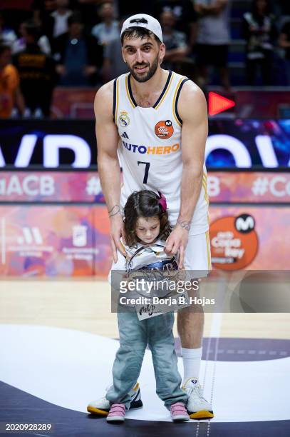 Facu Campazzo of Real Madrid with his daughter receive the MVP Trophy after the Finals of the 2024 Copa del Rey de Baloncesto match between Real...