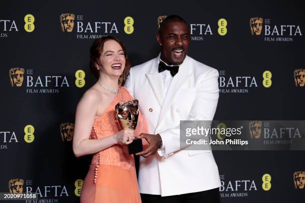 Emma Stone and Idris Elba pose in the Winners Room with the Leading Actress Award during the EE BAFTA Film Awards 2024 at The Royal Festival Hall on...