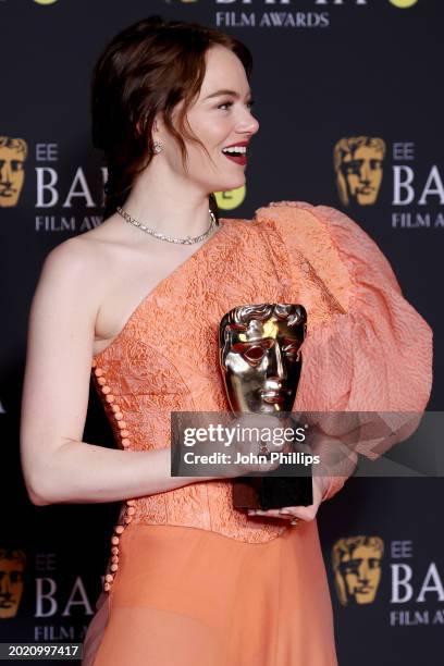 Emma Stone poses in the Winners Room with the Leading Actress Award during the EE BAFTA Film Awards 2024 at The Royal Festival Hall on February 18,...