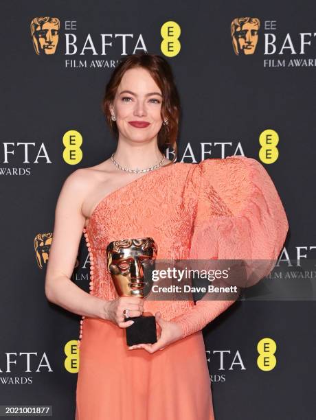 Emma Stone poses with the Leading Actress Award in the winners room during the 2024 EE BAFTA Film Awards at The Royal Festival Hall on February 18,...