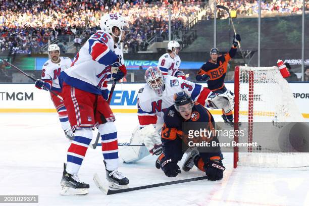 Mathew Barzal of the New York Islanders scores a goal past Igor Shesterkin of the New York Rangers during the first period during the 2024 Navy...