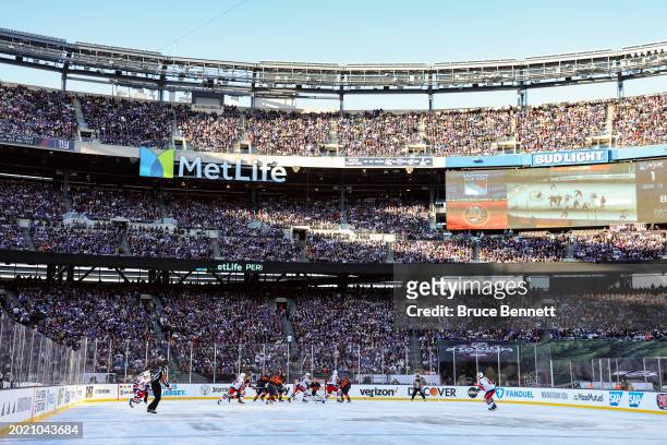 The New York Islanders and New York Rangers play during the first period during the 2024 Navy Federal Credit Union Stadium Series at MetLife Stadium...