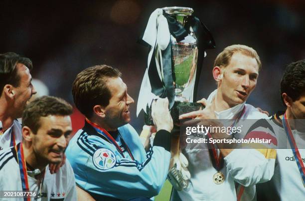 June 30: Andreas Kopke of Germany and Dieter Eilts of Germany celebrate with trophy after the UEFA Euro 1996 Final match between Czech Republic and...