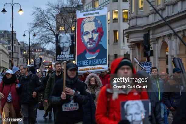 Supporters of Julian Assange march from the High Court to Downing Street on February 21, 2024 in London, England. The two-day hearing in London...