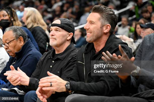 Washington Commanders head coach Dan Quinn and general manager Adam Peters are introduced to the crowd during the first half of the game between the...