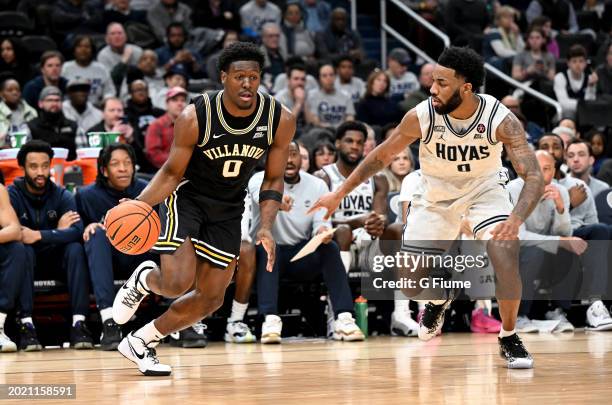 Bamba of the Villanova Wildcats handles the ball against Dontrez Styles of the Georgetown Hoyas at Capital One Arena on February 16, 2024 in...