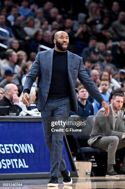 Head coach Kyle Neptune of the Villanova Wildcats watches the game against the Georgetown Hoyas at Capital One Arena on February 16, 2024 in...