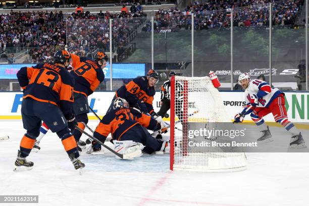 Vincent Trocheck of the New York Rangers scores a goal past Ilya Sorokin of the New York Islanders during the second period during the 2024 Navy...